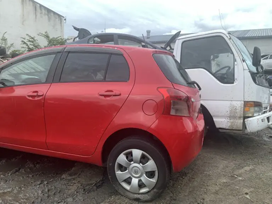 Scrap car and tow truck ready for removal in Whakatane